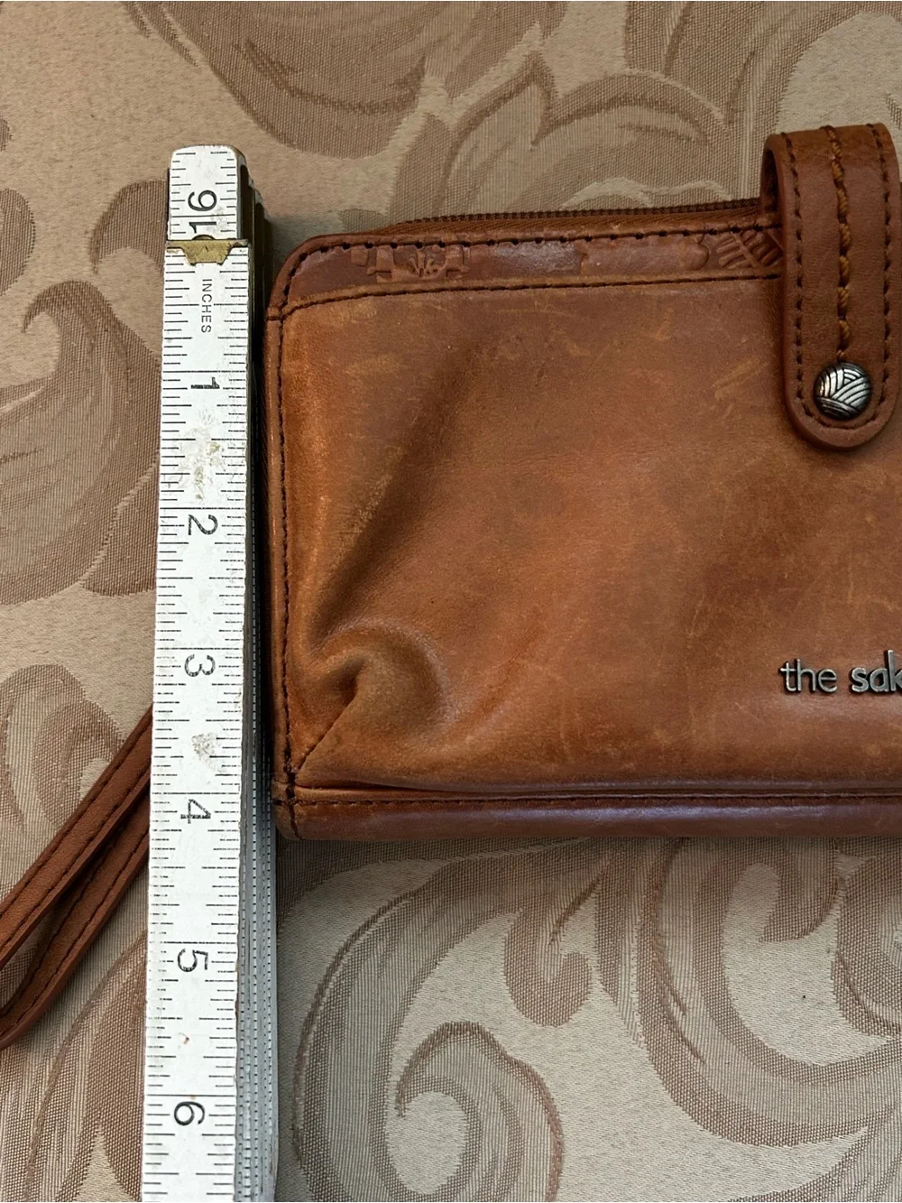 The Sak Smartphone Wristlet Wallet Iris Tobacco Brown Flower Embossed